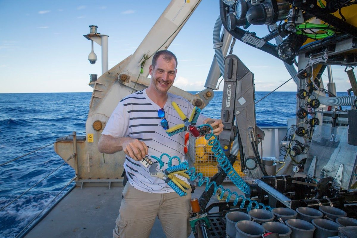 Daniel M. Vogt on a research vessel with a soft robotic gripper